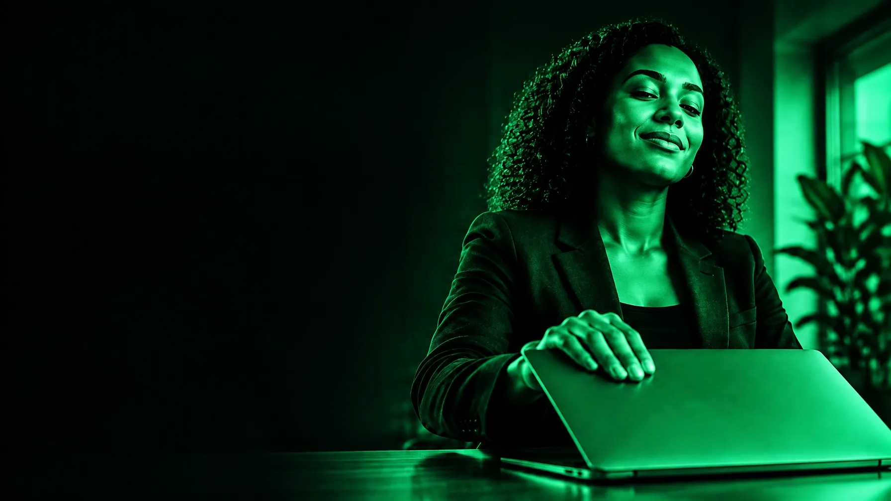 A tax professional working at a laptop in a calm, modern office